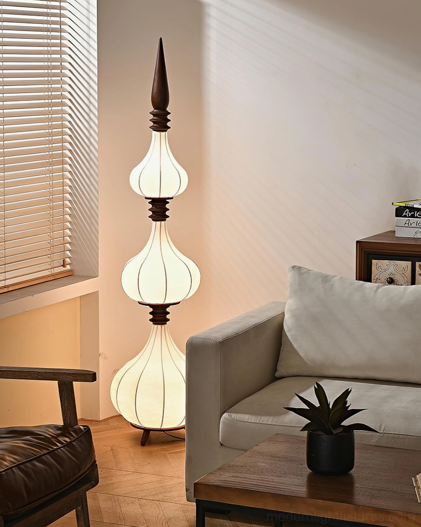 Illuminated Sultano gourd floor lamp casting warm ambient light in bohemian living room interior