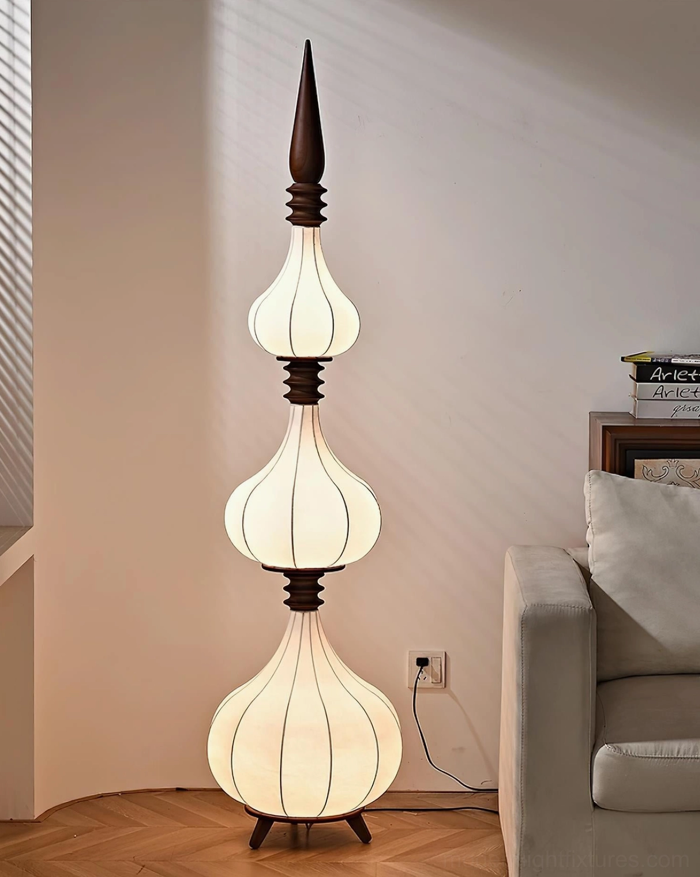 Sultano floor lamp in minimalist interior showing sculptural presence and warm 3000K lighting