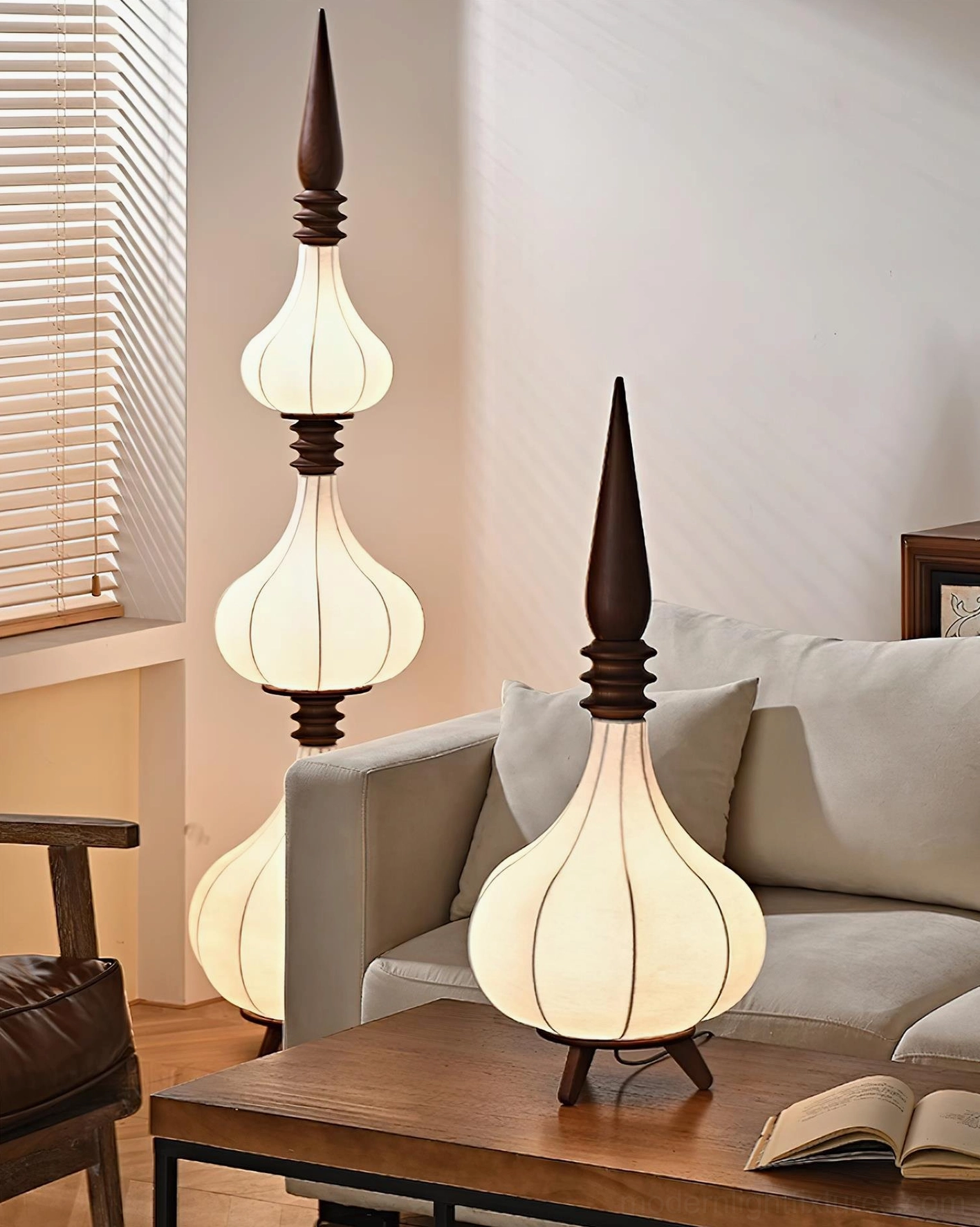 Two Sultano floor lamps of different heights creating layered lighting in modern living room