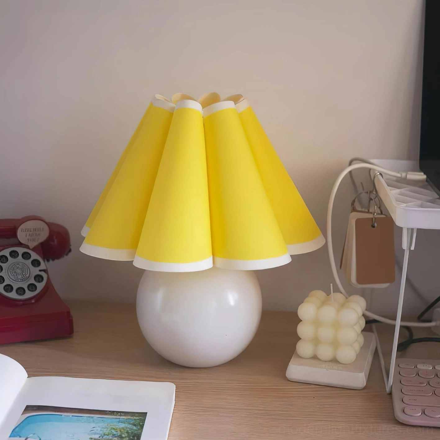 Sunburst pleated table lamp stylish lighting fixture creating warm ambient light in contemporary home environment