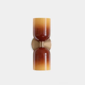 Sunflare dual-head glass wall sconce with gradient amber caramel glass shades and brushed brass hardware front view