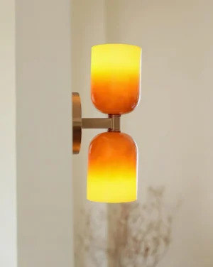 Sunflare wall lamp mounted on residential hallway wall showing side profile and glass shade gradient detail