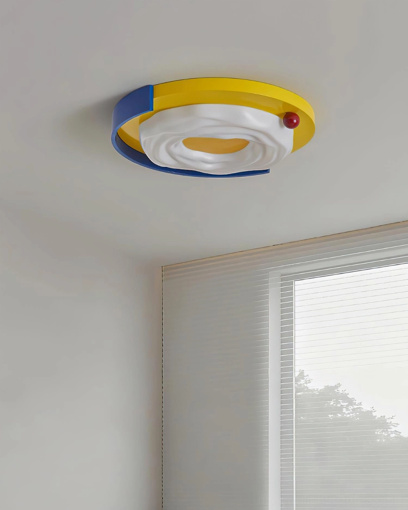 Sunpetal playful ceiling light side view showing color-blocked design and white diffuser panel in residential bedroom