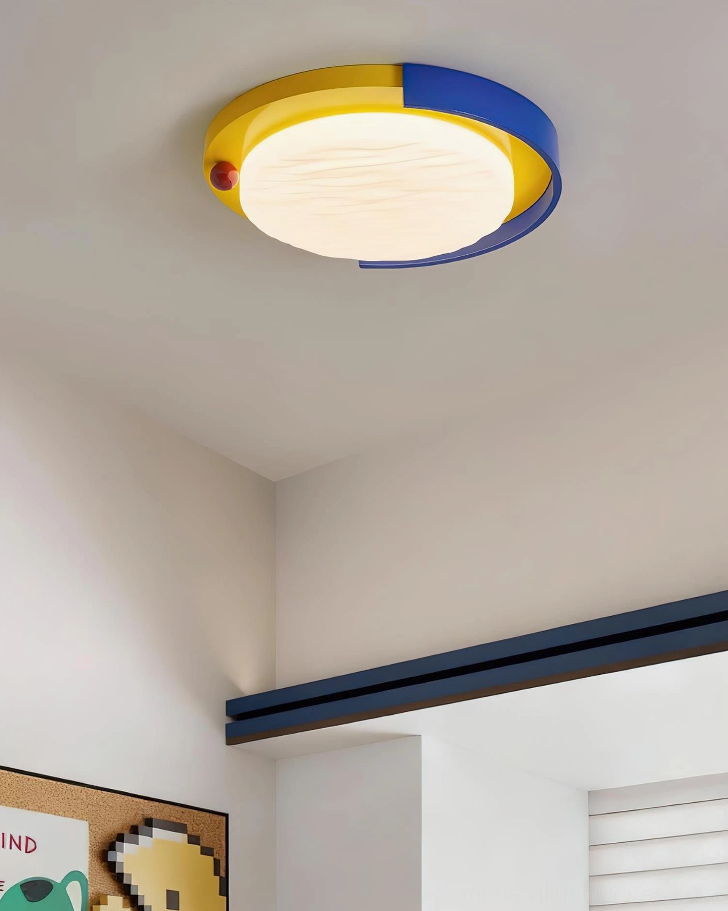 Sunpetal color-blocked ceiling lamp corner installation view with matte white shade and yellow-blue trim accent