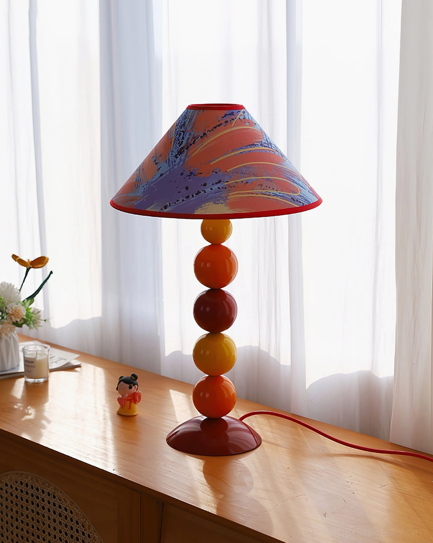 Purple-blue gradient printed table lamp shade near window with bohemian desk decor - bright airy modern home lighting