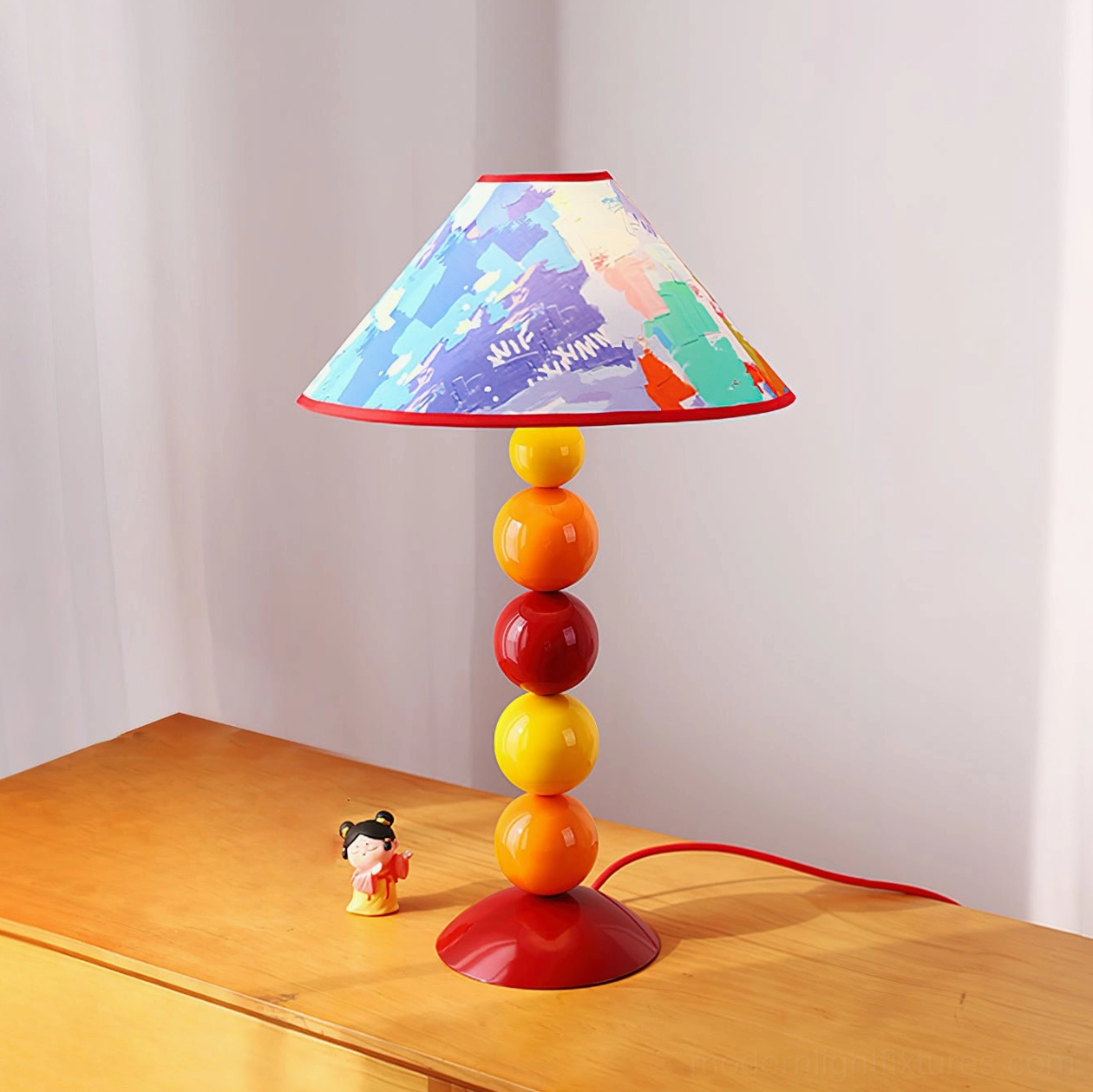 Modern beaded table lamp with warm-toned spherical post and artistic printed shade - contemporary decorative home fixture