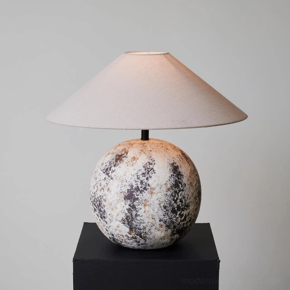 Right front three-quarter view of Surya ceramic textured lamp base - mottled finish detail on grey studio background