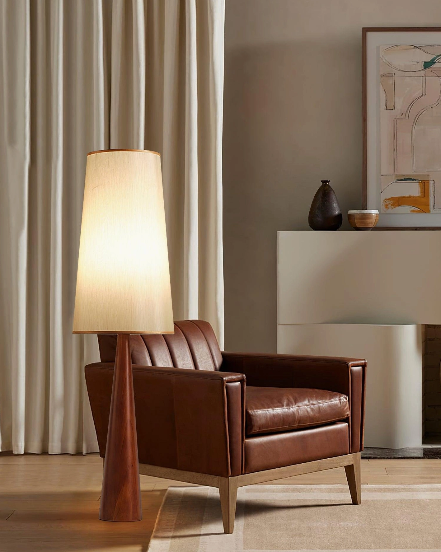 Svelte tapered floor lamp mid-century retro living space with brown leather armchair
