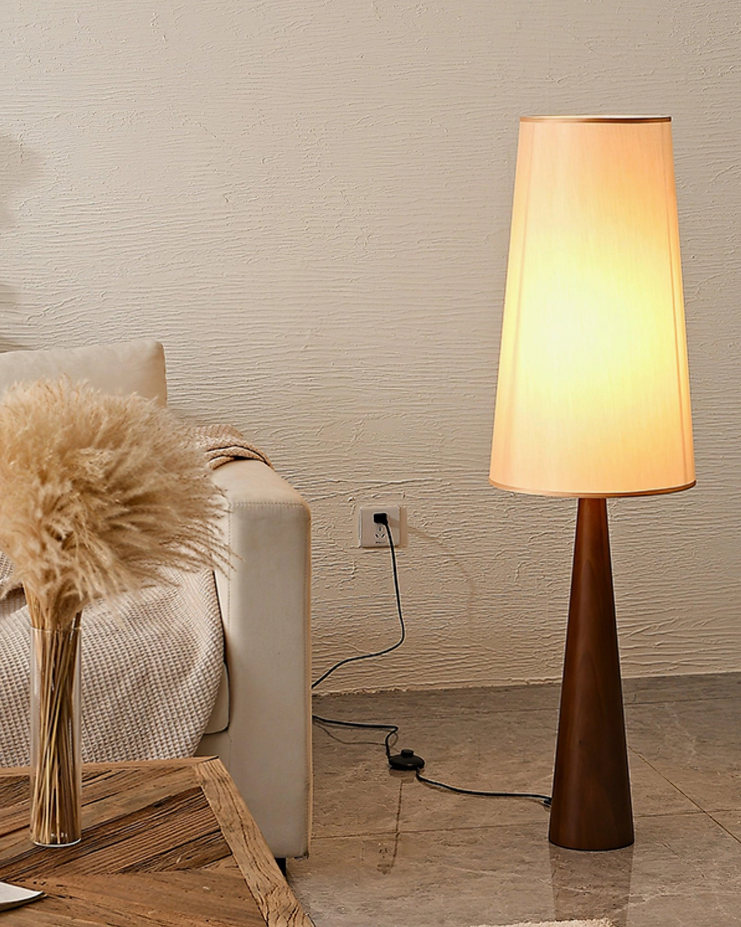 Svelte wooden floor lamp side view in cozy rustic living room with pampas grass decor