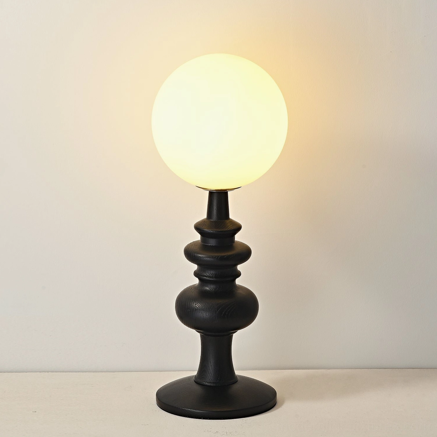 Sveta globe table lamp color options - walnut and black ash wood base variants available