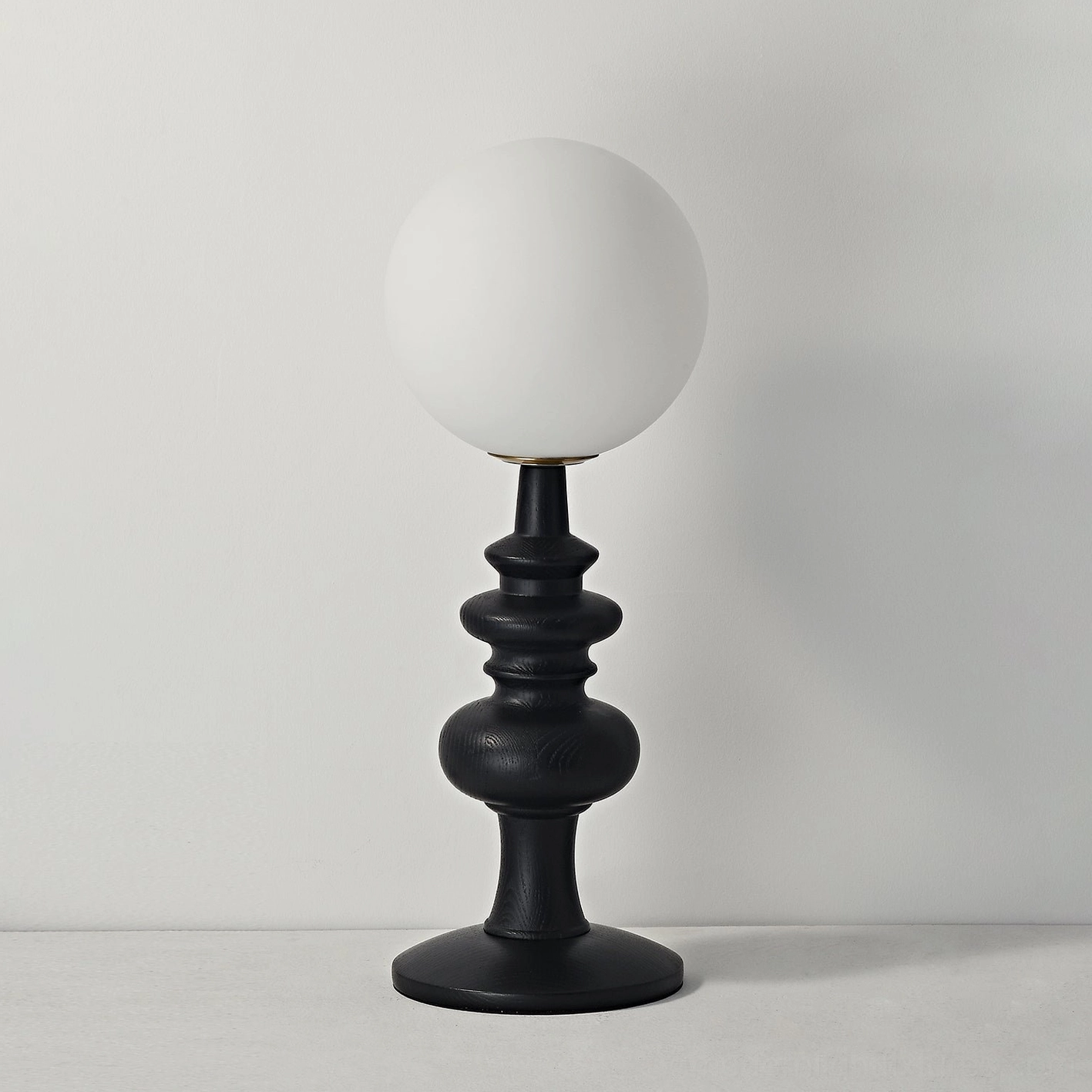 Sveta table lamp in contemporary interior setting - ash wood globe lamp with minimalist aesthetic