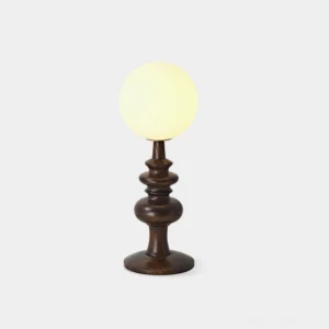 Sveta globe table lamp with dark walnut wood base and frosted glass shade - front view studio photography