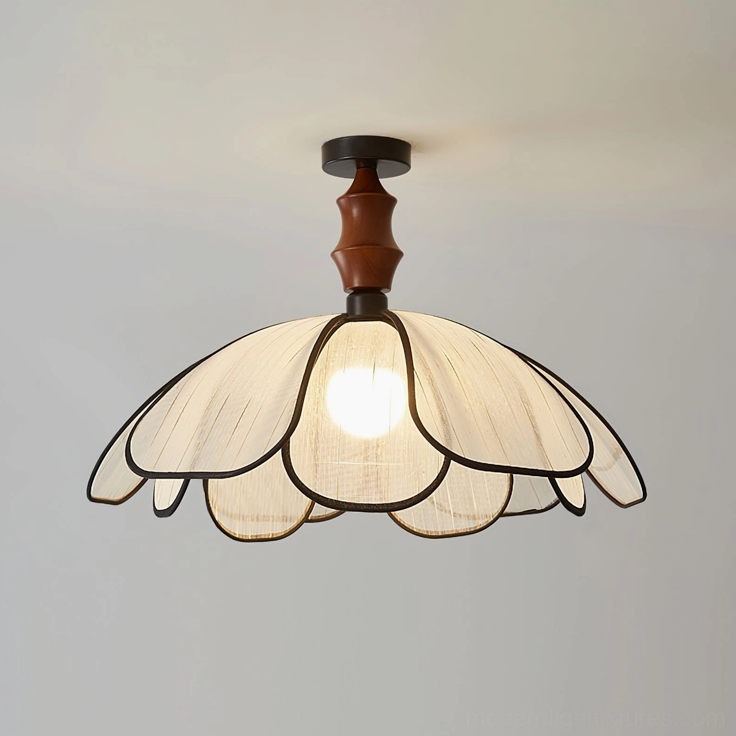 Swanpetal semi-flush petal ceiling light with illuminated bulb, warm studio background, walnut wood metal fixture