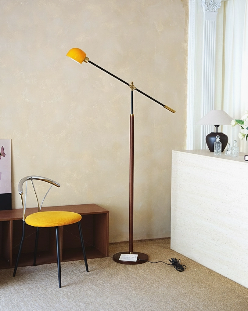 Mid-century modern swing floor lamp base detail showing weighted round metal base and stability features