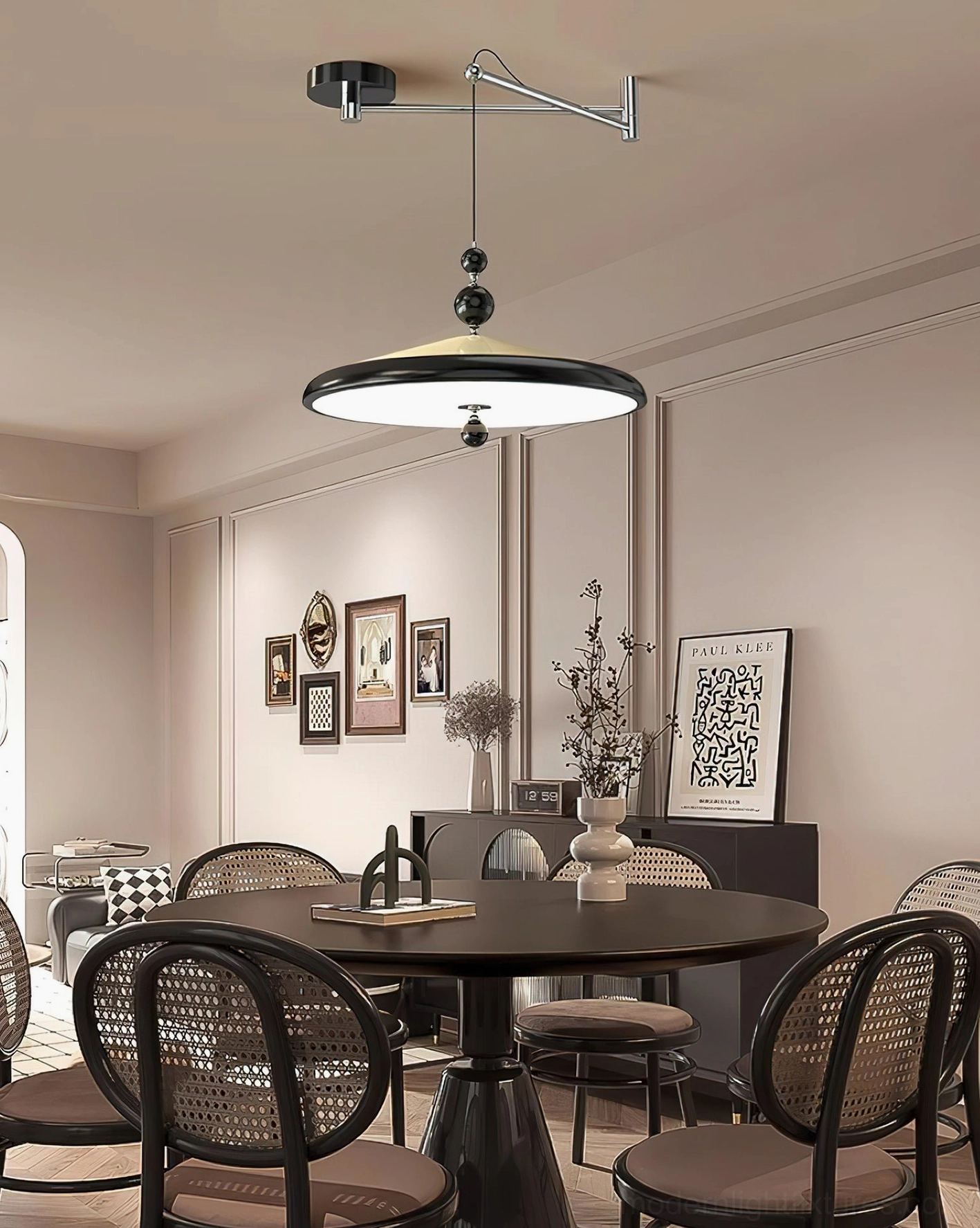 Black swing arm pendant lamp with dark shade accents in formal dining room with sophisticated dark-toned interior design