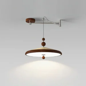Adjustable swing arm pendant light hanging from ceiling, casting warm ambient light downward in minimalist interior setting