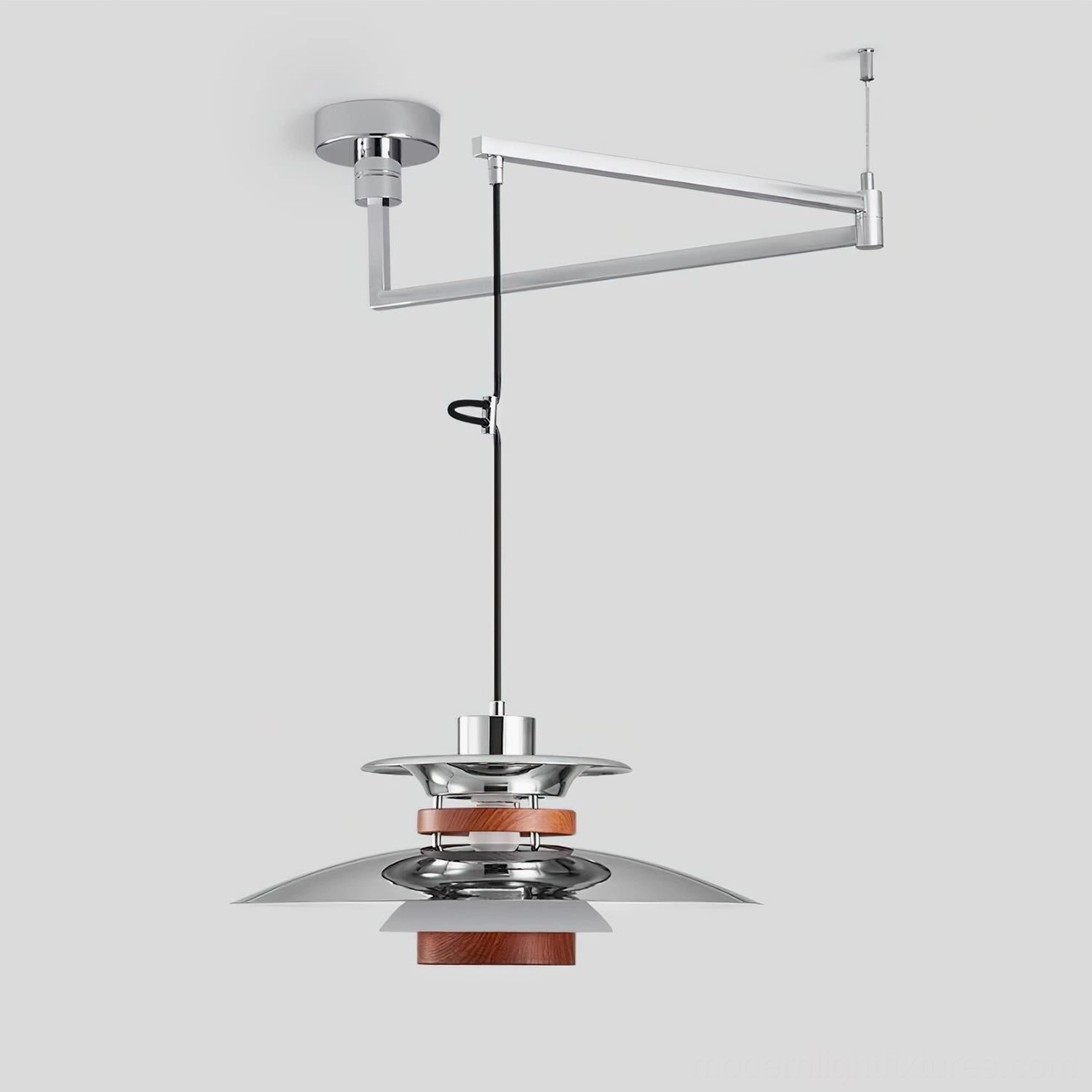 Swing arm pendant lamp with refined layered metal shade, detailed studio view