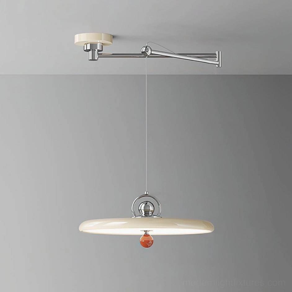 Beige swing arm pendant light in neutral studio lighting, showcasing off-white disc shade with polished metal articulating arm
