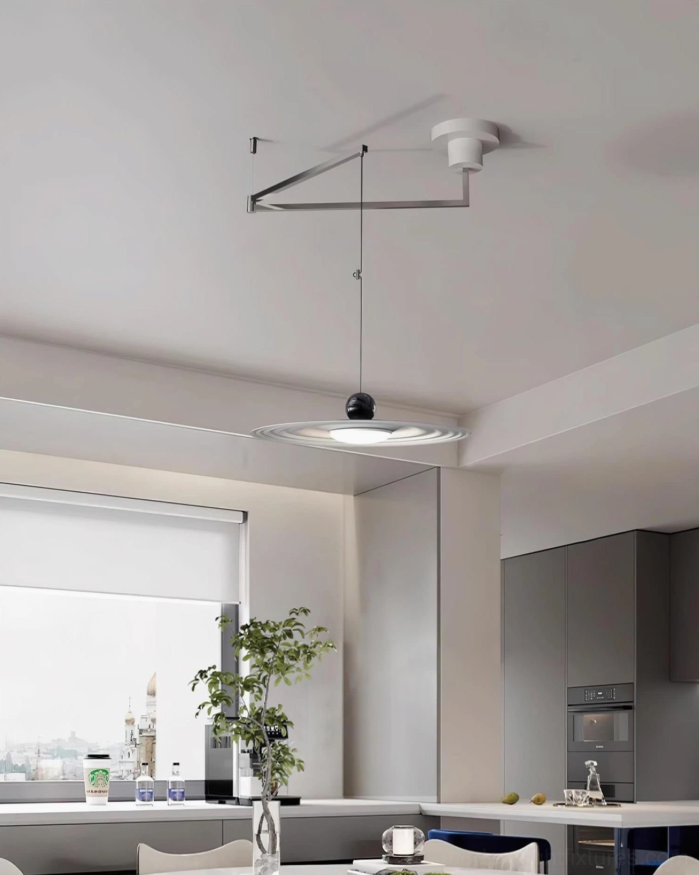 Contemporary swing arm pendant lighting in modern dining kitchen area with light wood and white cabinetry