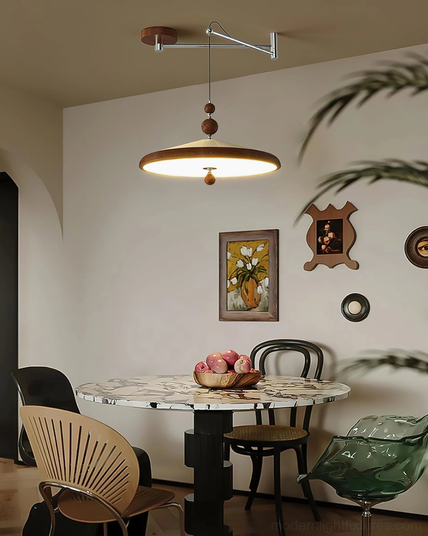 Modern swing arm pendant light suspended above round marble dining table in contemporary dining room, eye-level perspective showing functional elegance
