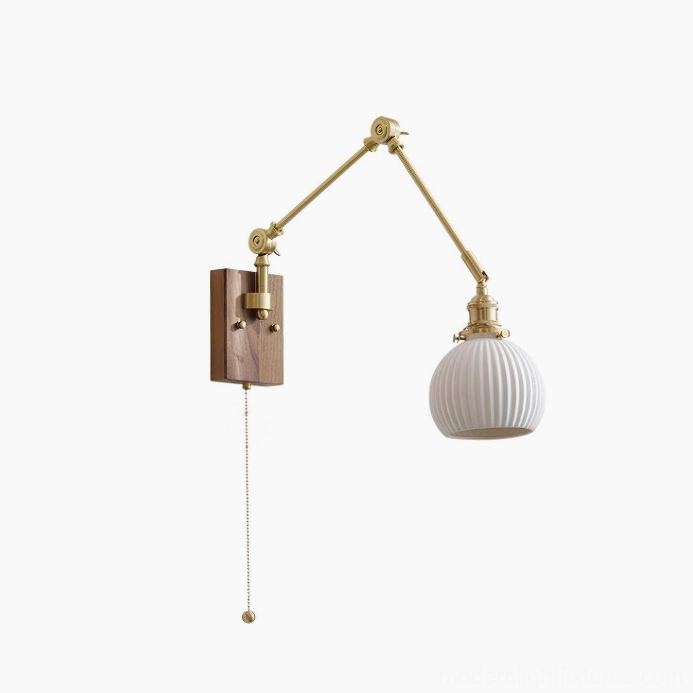 Swing arm wall sconce with pull chain switch detail and brass articulated arm mechanism
