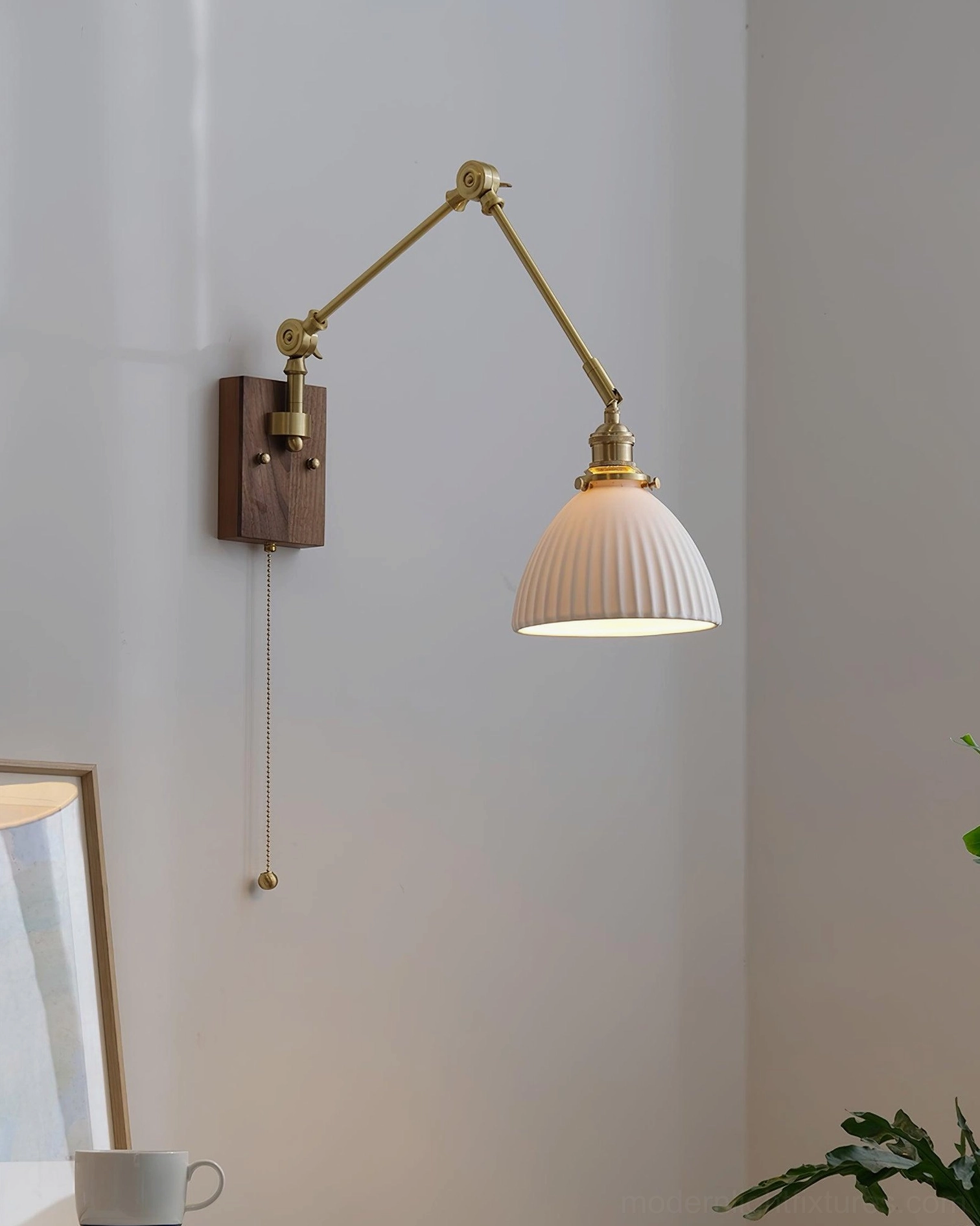 Low-profile ribbed dome ceramic shade swing arm sconce, side view in residential corner