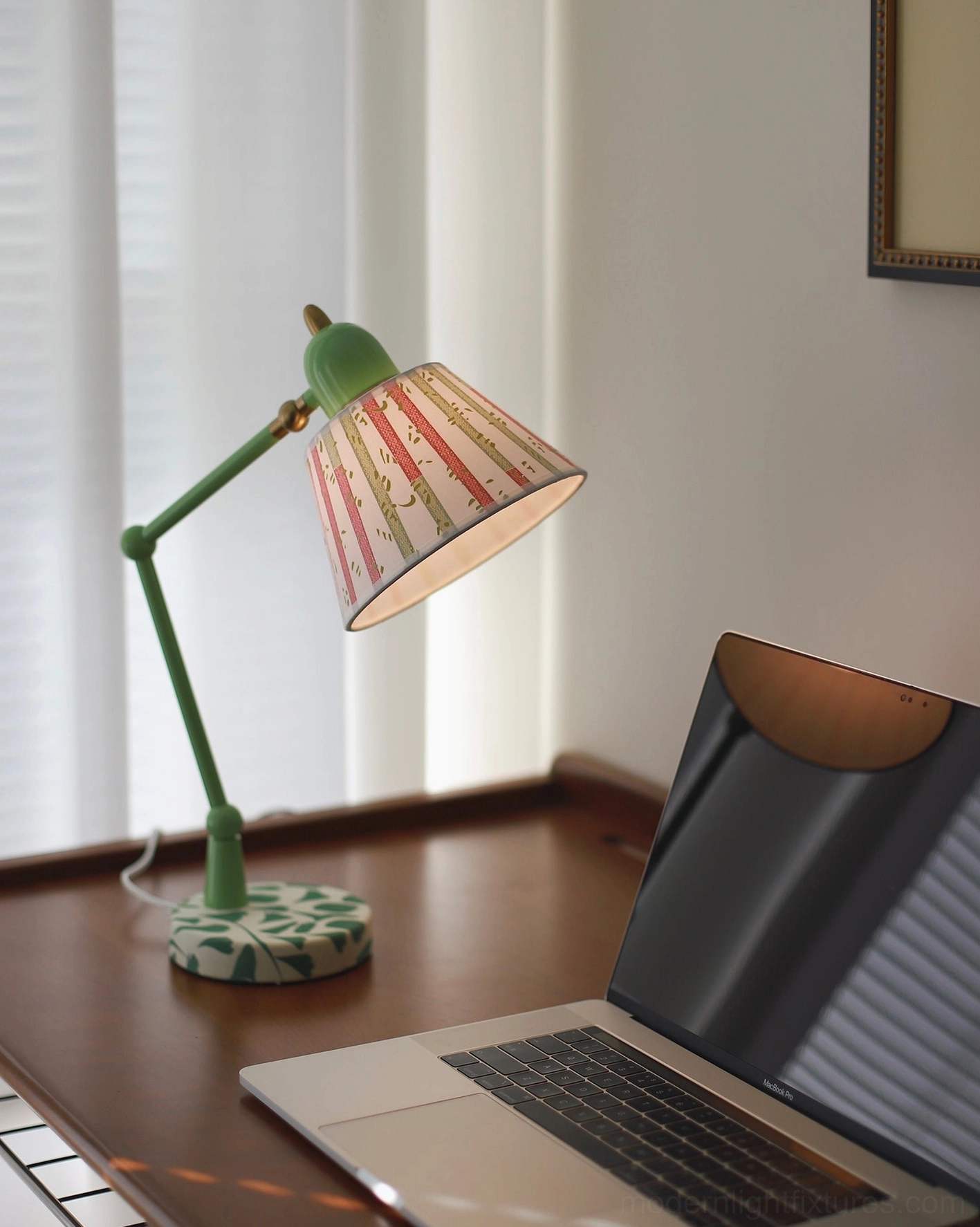 Green swing arm table lamp with ornate leaf-motif base and hand-painted striped fabric shade, product detail