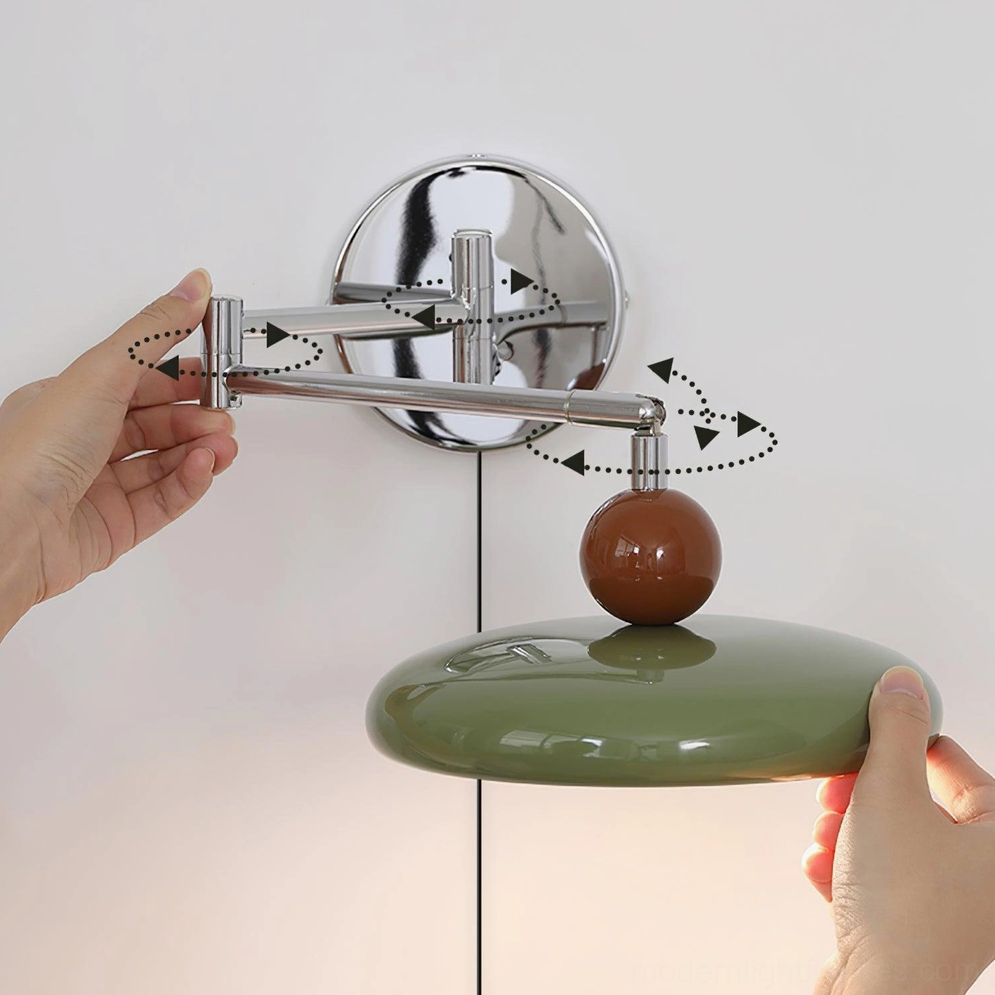 Plug-in wall sconce detail showing articulated arm mechanism and polished chrome finish, contemporary fixture hardware
