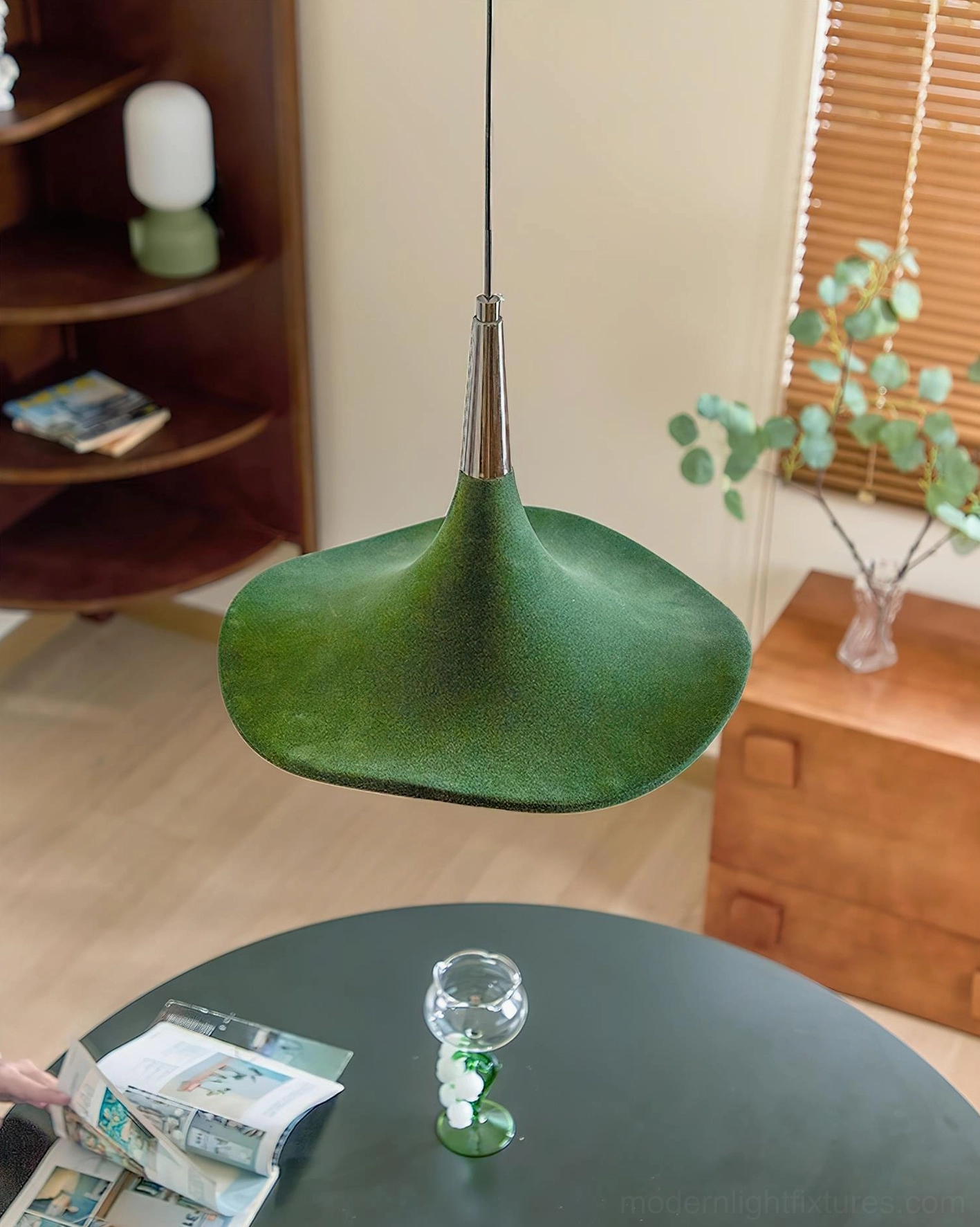 Overhead view of Sylva Drift pendant light suspended above modern dining table with warm ambient glow