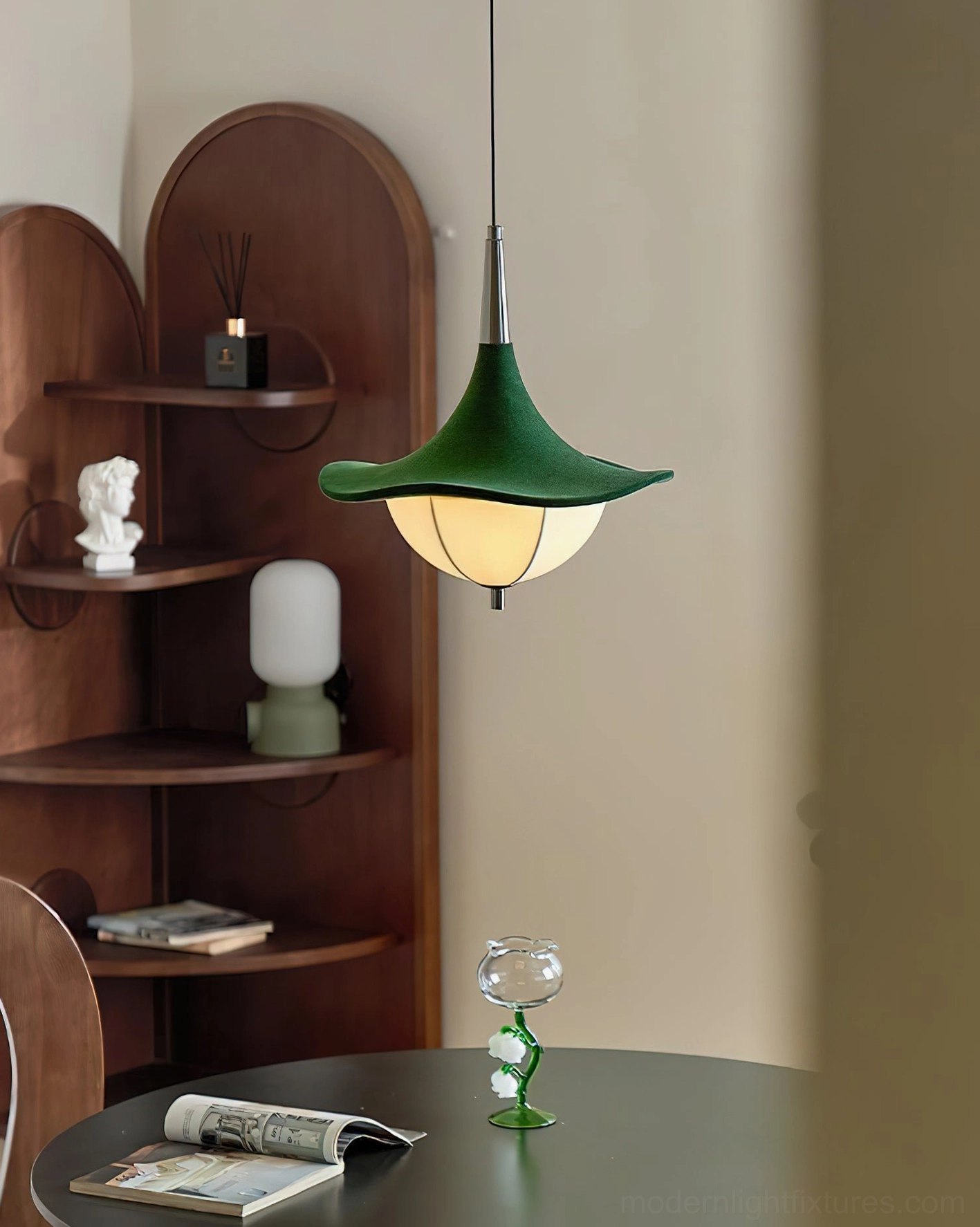 Sylva Drift vintage-style pendant lamp in relaxed dining corner with arched wooden shelving and magazines
