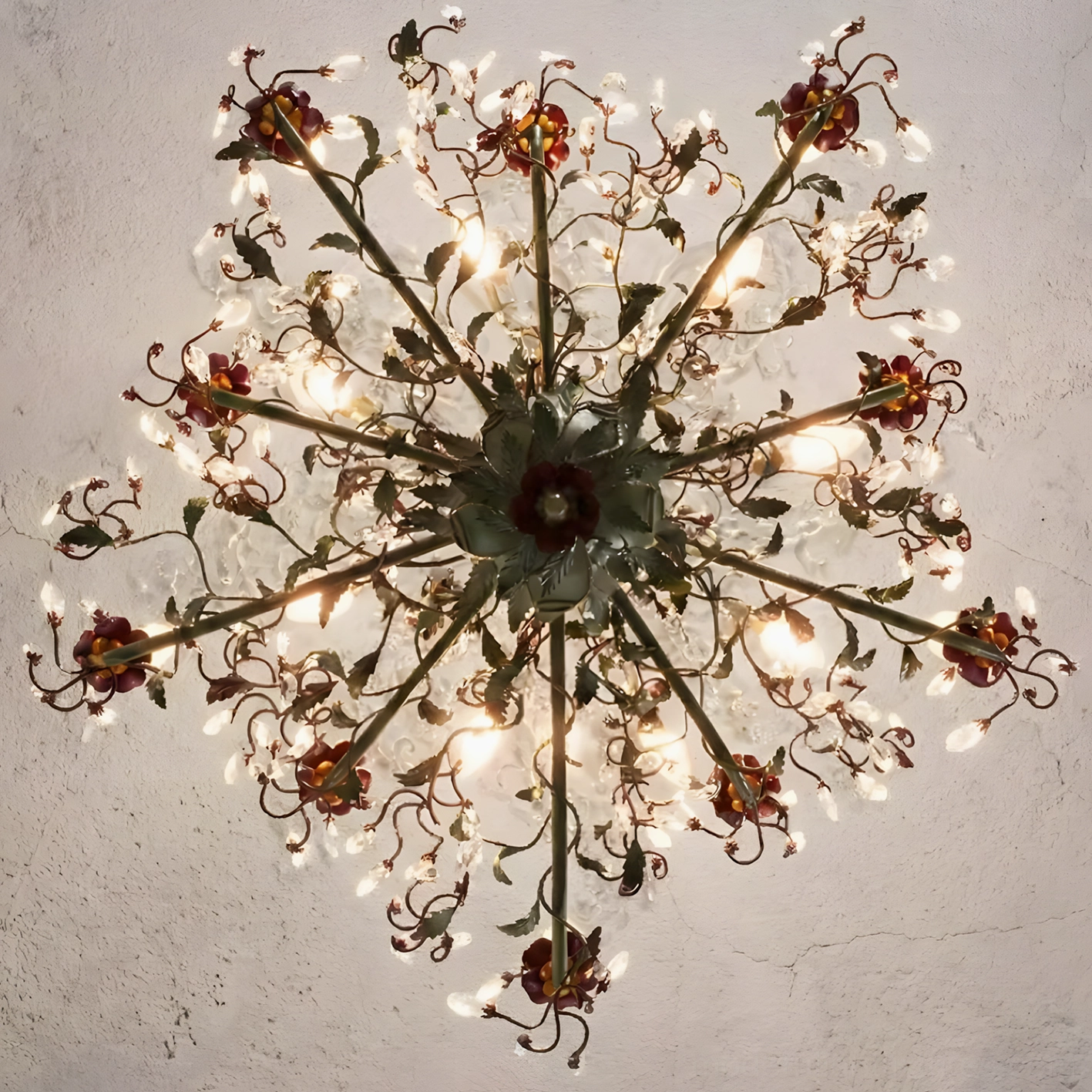 Sylvarose crystal chandelier detail view showing hand-finished vine-like branches and leaf metalwork