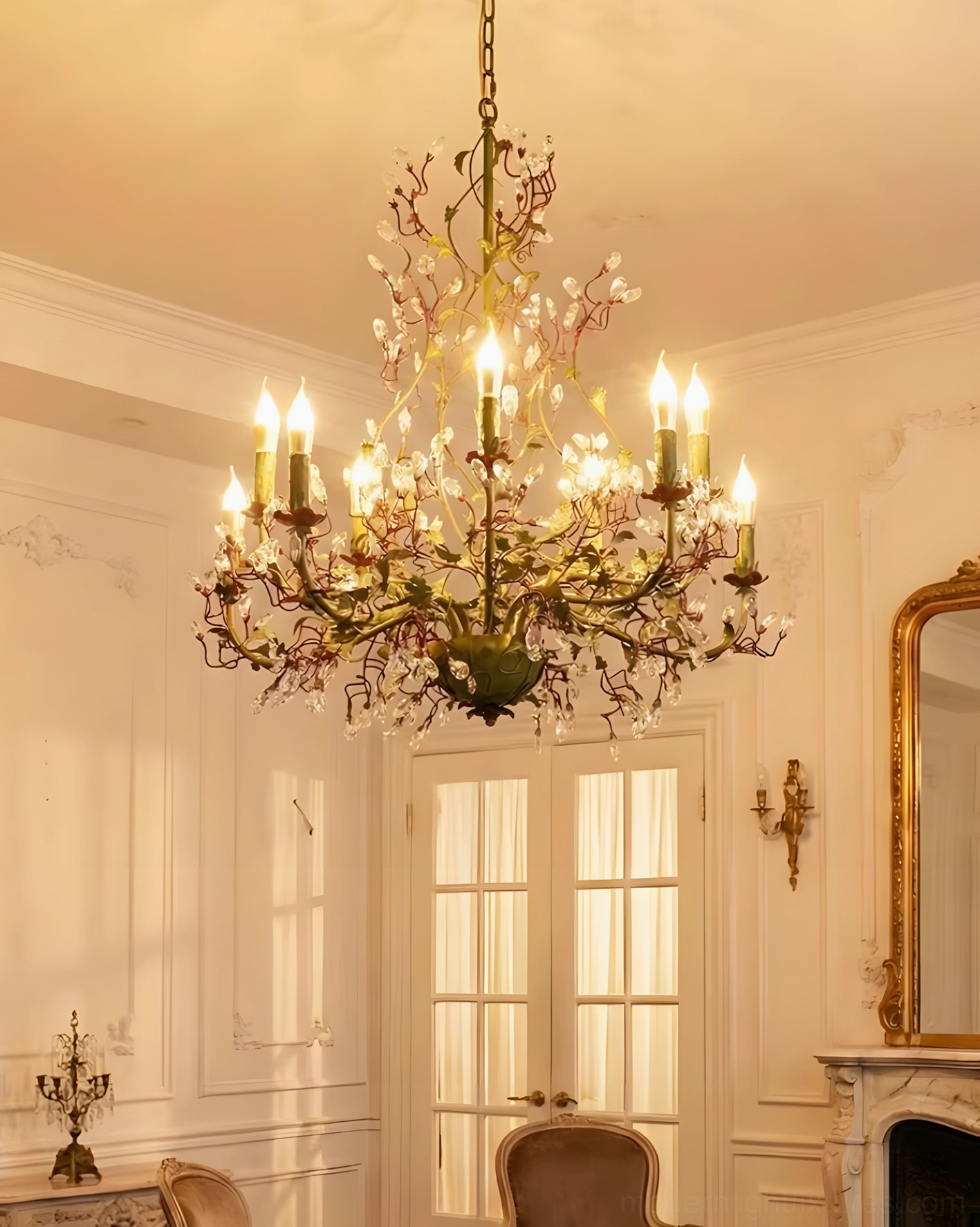 Sylvarose crystal chandelier showing metalwork frame and delicate leaf details in warm lighting