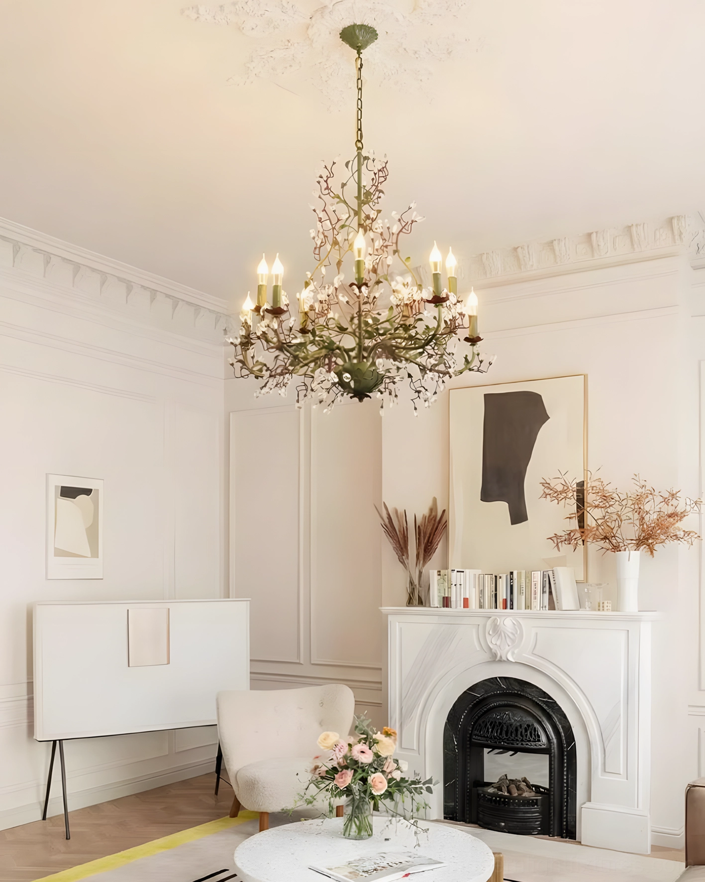 French country Sylvarose chandelier with green metal frame and candle bulbs in vintage fireplace living room