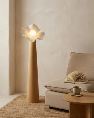 Three-quarter view of Sylvelle modern floor lamp in minimalist living room with linen sofa and neutral decor