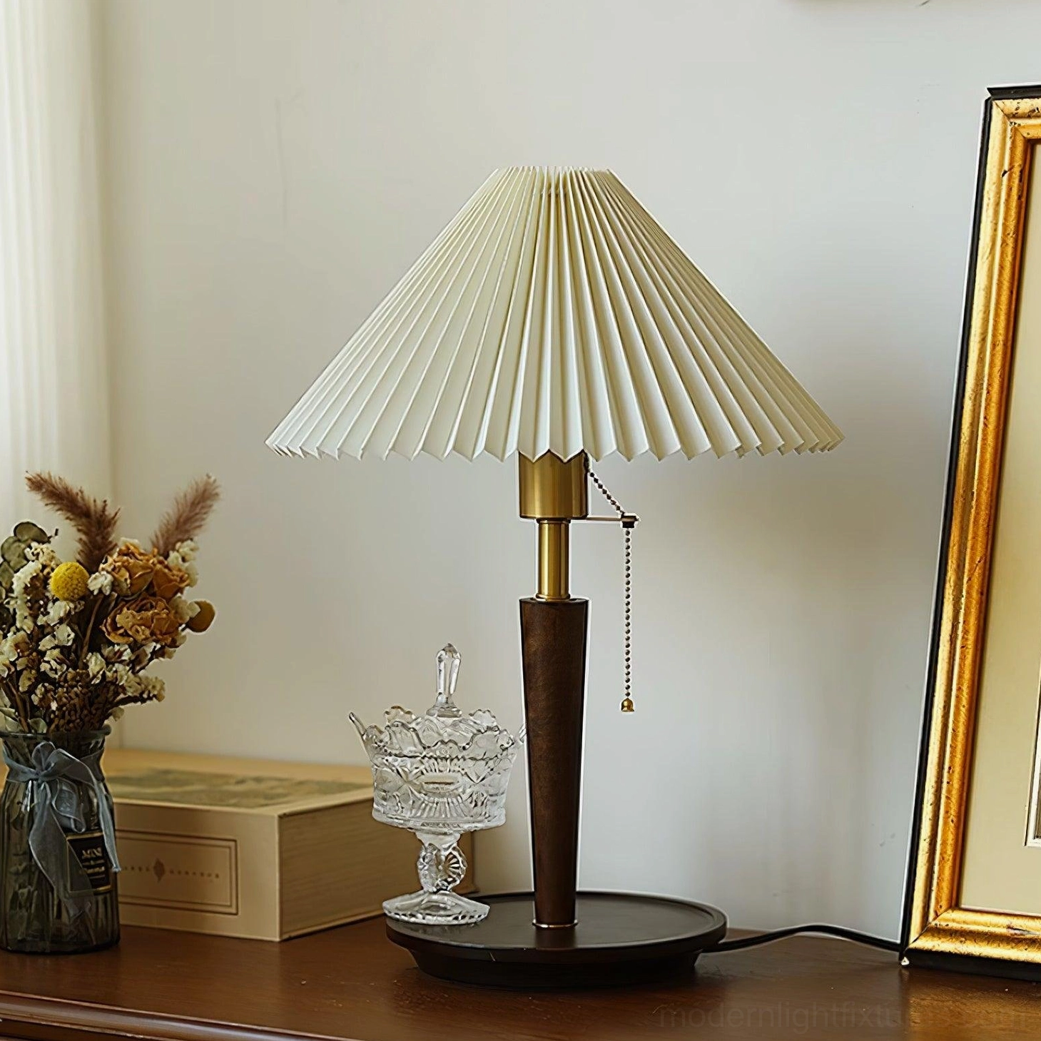 Suki pleated table lamp base detail showing solid wood construction and brass-finished stem connection
