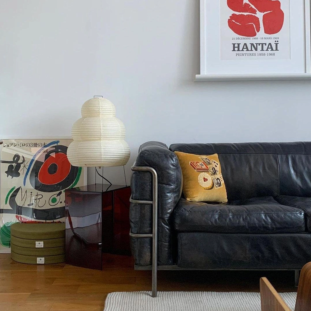 Tiered Shoji lamp beside interior furnishings, styling coordination and design placement