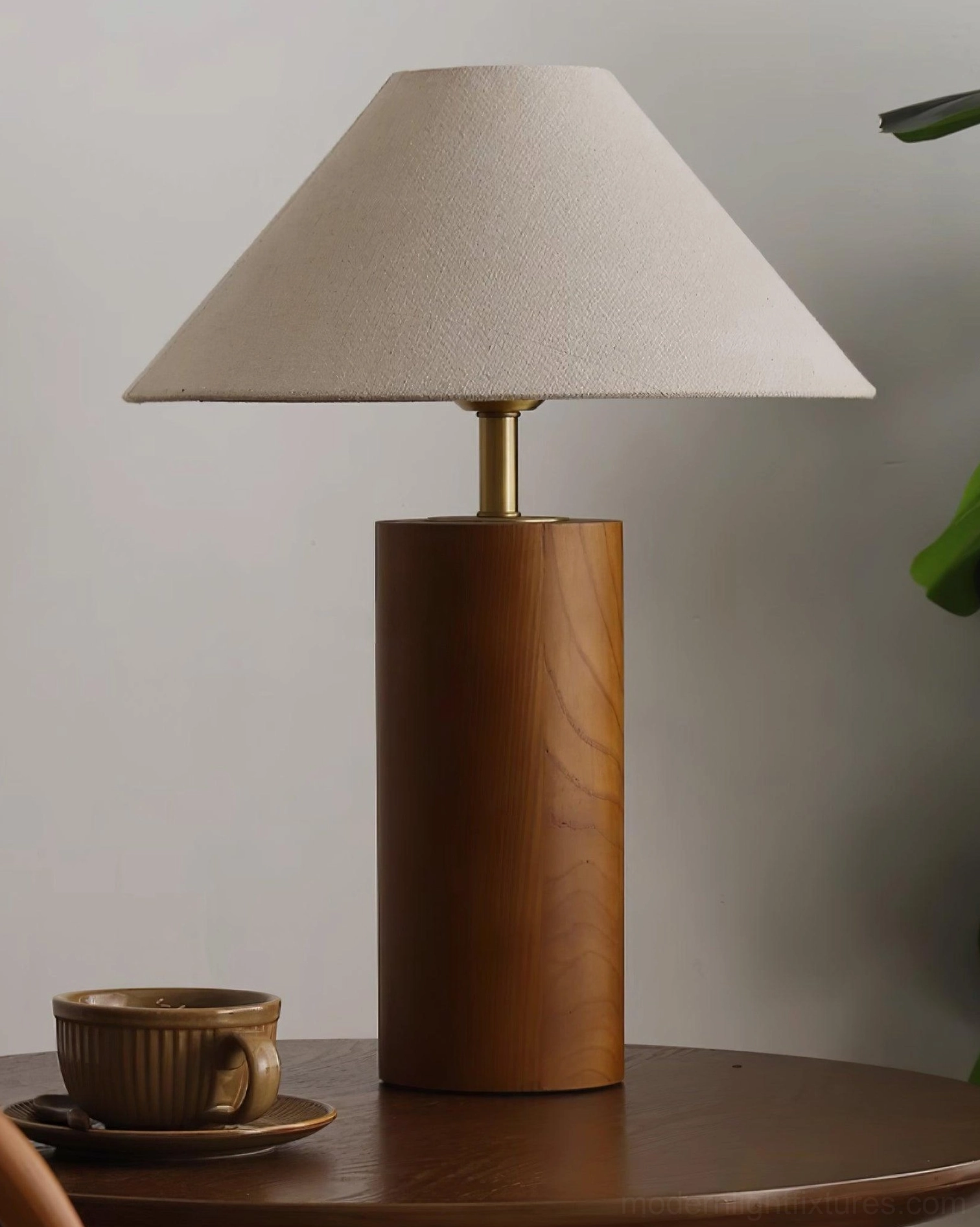 Cylindrical wooden desk lamp styled in contemporary home office environment with workspace
