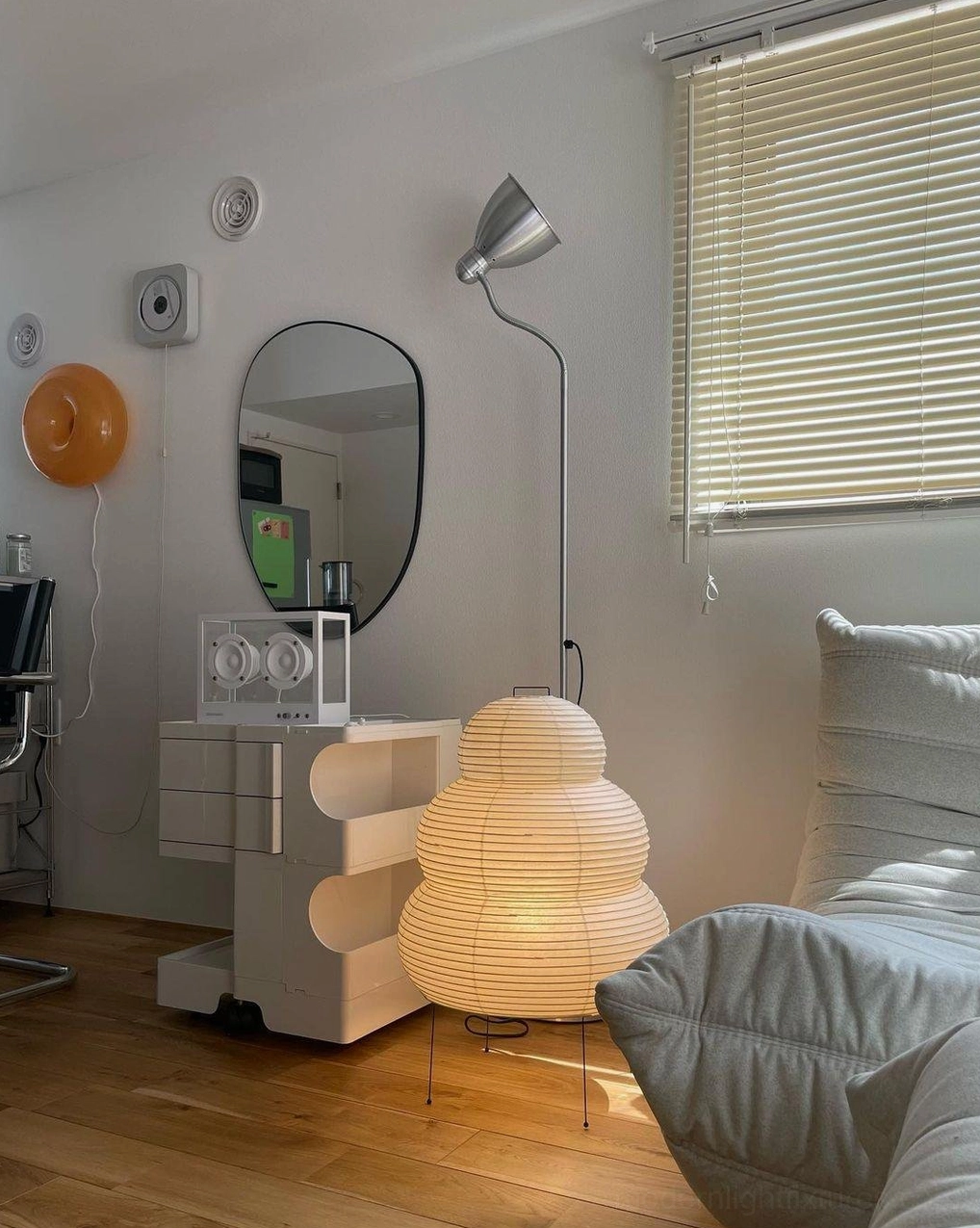 Modern tiered Shoji table lamp in living space, contemporary lighting fixture placement