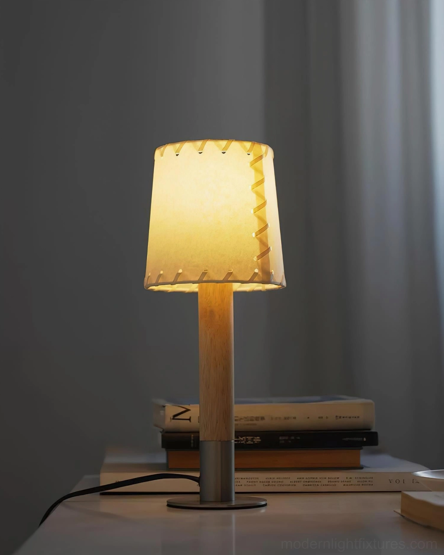 Modern minimalist table lamp metal base and wood pole construction close-up view