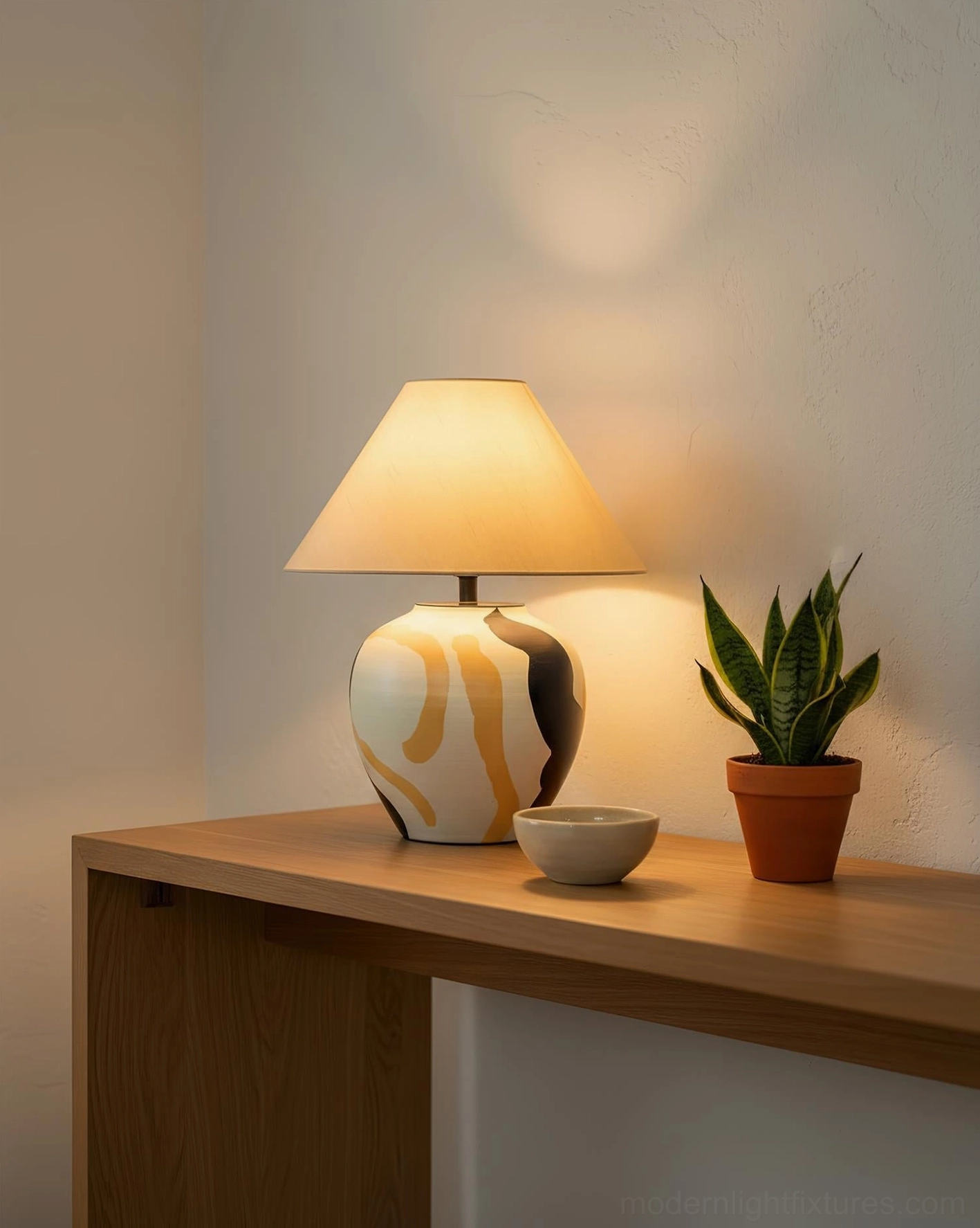 Desert Swirl ceramic table lamp on cozy bedroom side table corner with potted succulent and decorative bowl arrangement