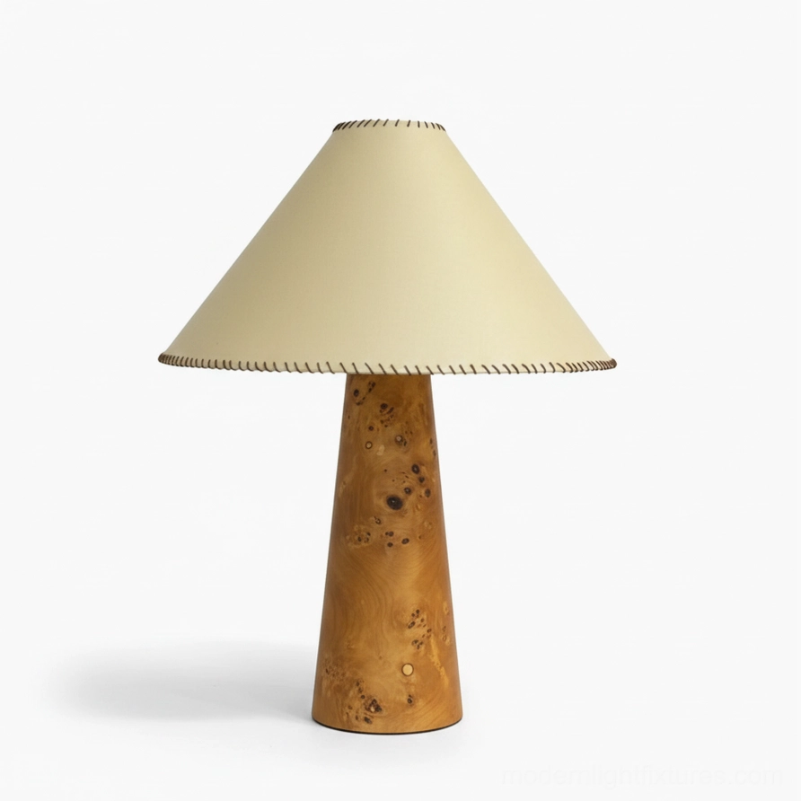 Close-up detail of beige fabric shade with visible whip-stitch edge construction on wood table lamp