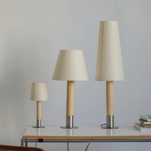 Three sizes of modern minimalist table lamps displaying small medium and large stitched fabric shade designs