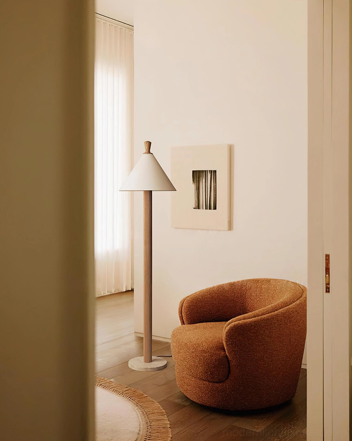 Takumi modern floor lamp with light wood finish in cozy reading nook neutral home decor