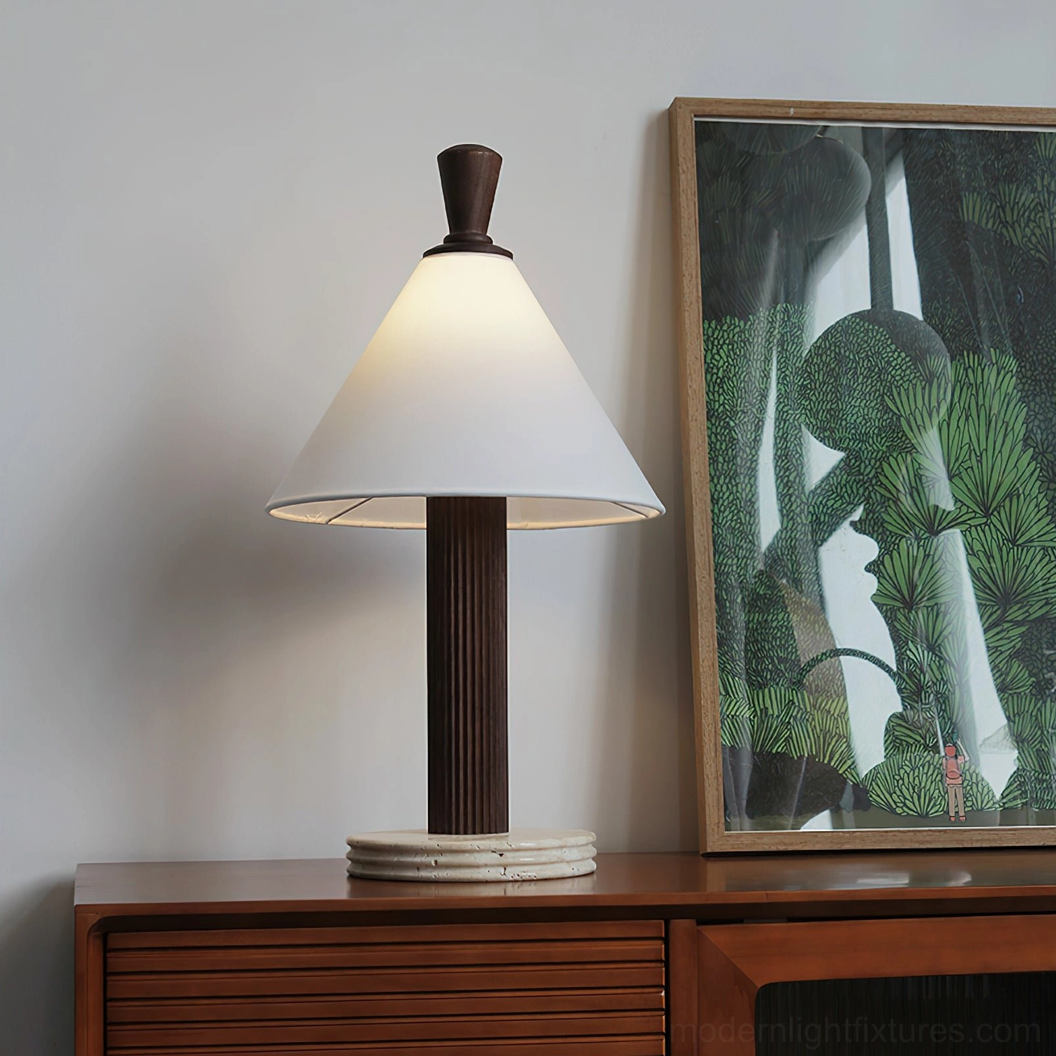 Takumi table lamp with dark fluted wood pole displayed on living room side cabinet next to wall artwork