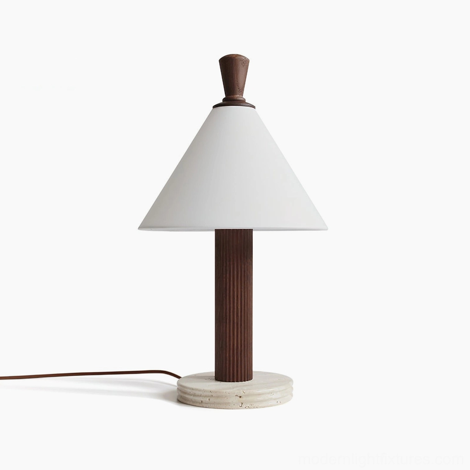Takumi table lamp with walnut-finish fluted wood pole, travertine base, and white linen shade in studio