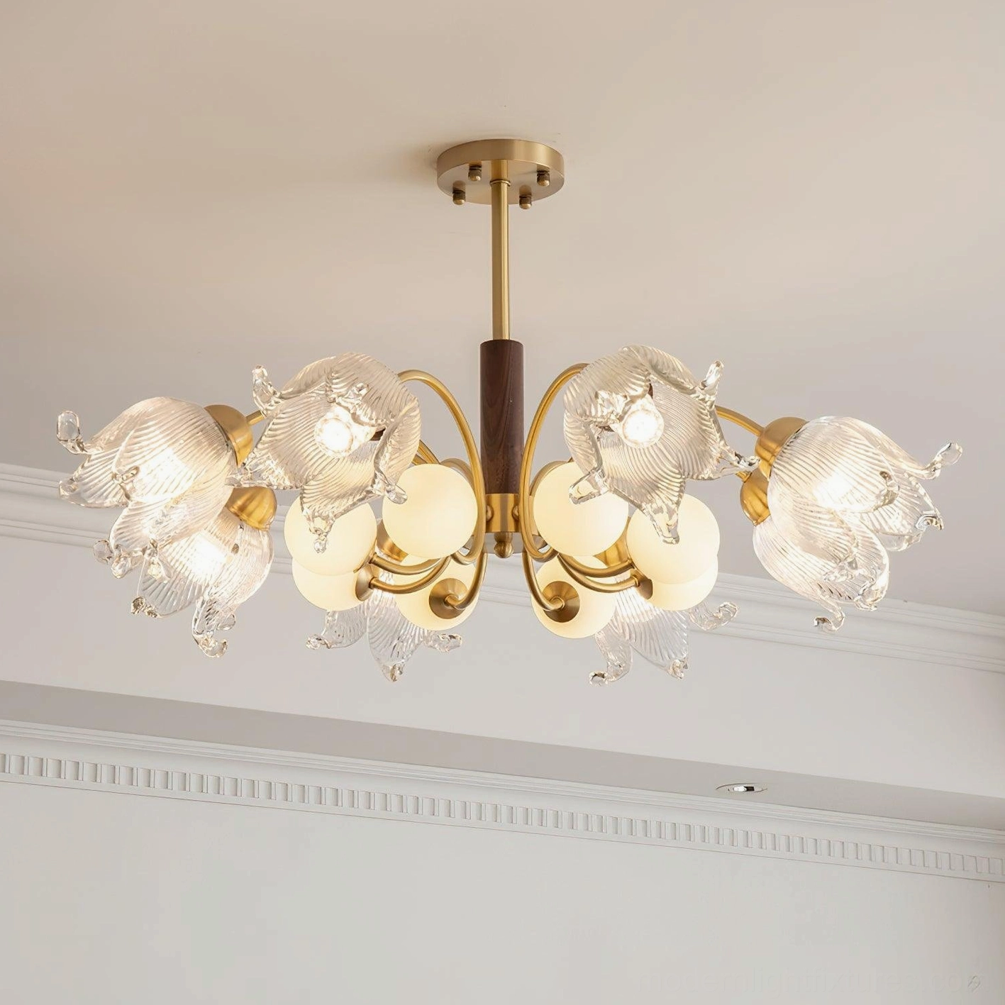 Talia modern 8-head chandelier detail view brass frame with frosted white spheres and glass