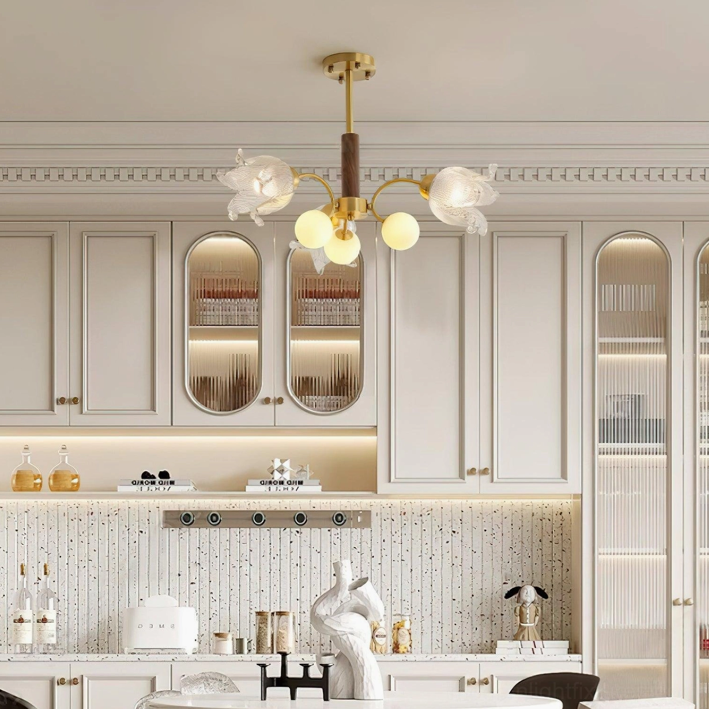 Talia modern chandelier fixture with warm light cast on ceiling and walls creating shadow play