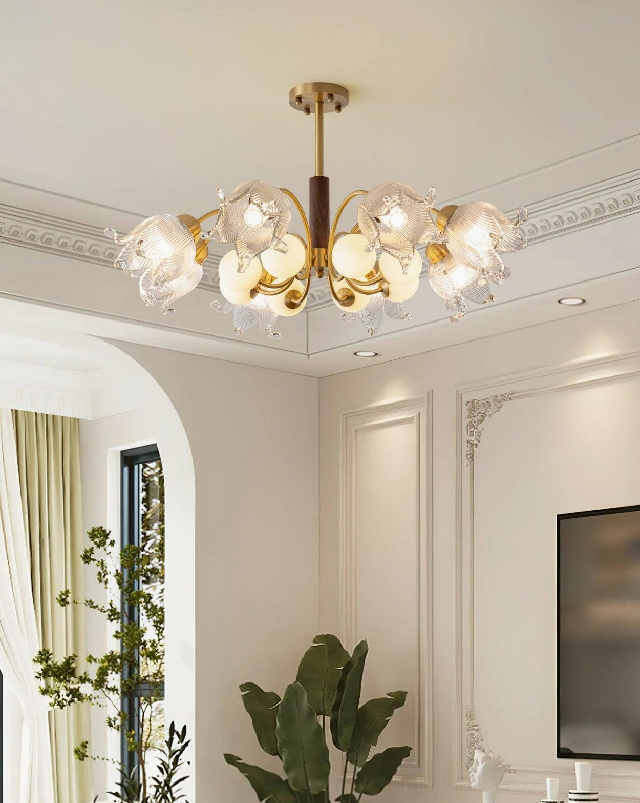 Talia modern chandelier illuminated in luxury French living room with arched doorway and green plants