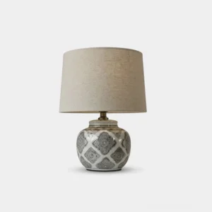 Talora ceramic table lamp with geometric patterned grey base and natural linen drum shade, front studio product view