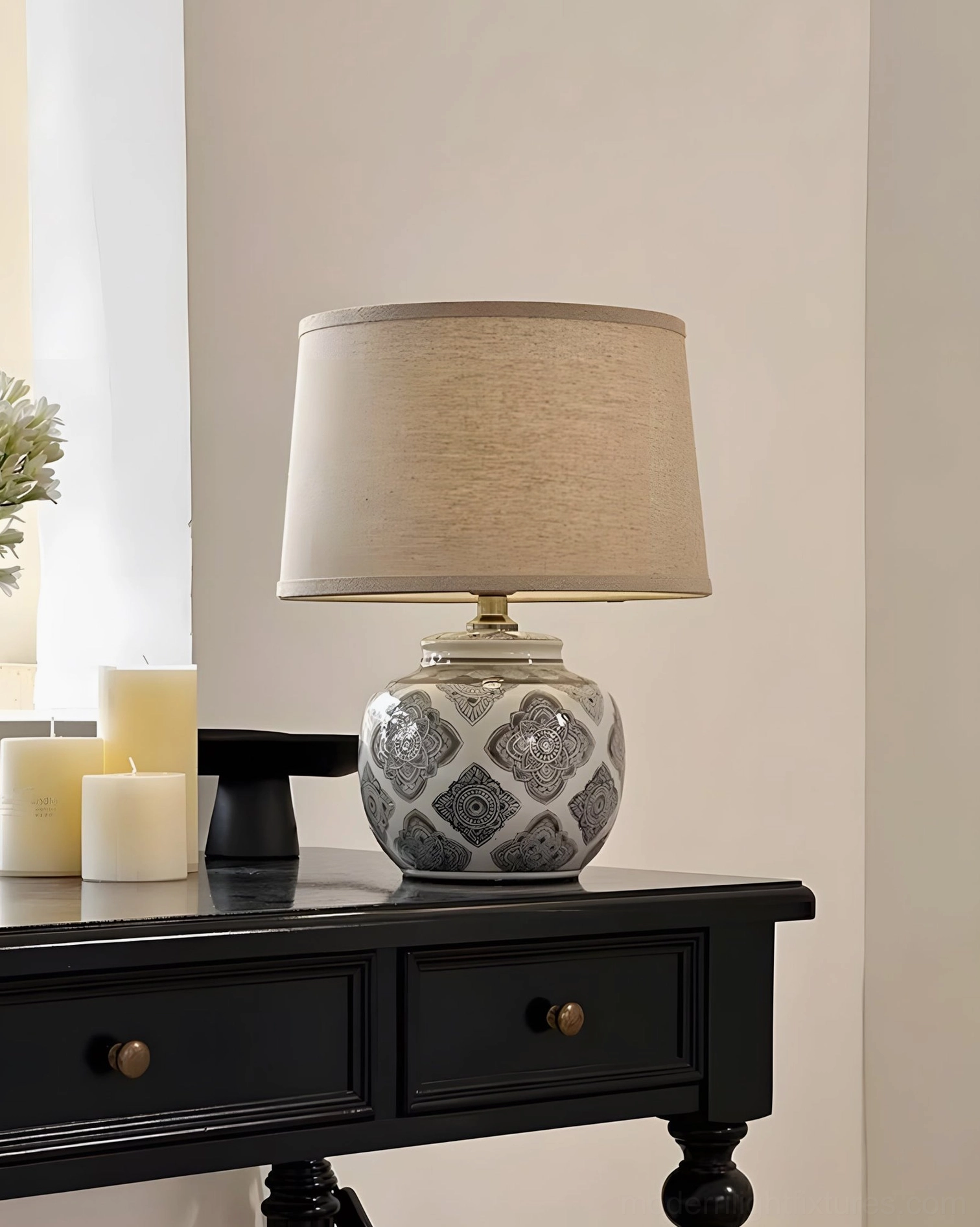 Modern ceramic table lamp with geometric base and natural linen fabric shade three-quarter view